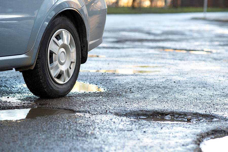 Navigating the Bumpy Road: A Guide to Preventing and Repairing Parking Lot Potholes